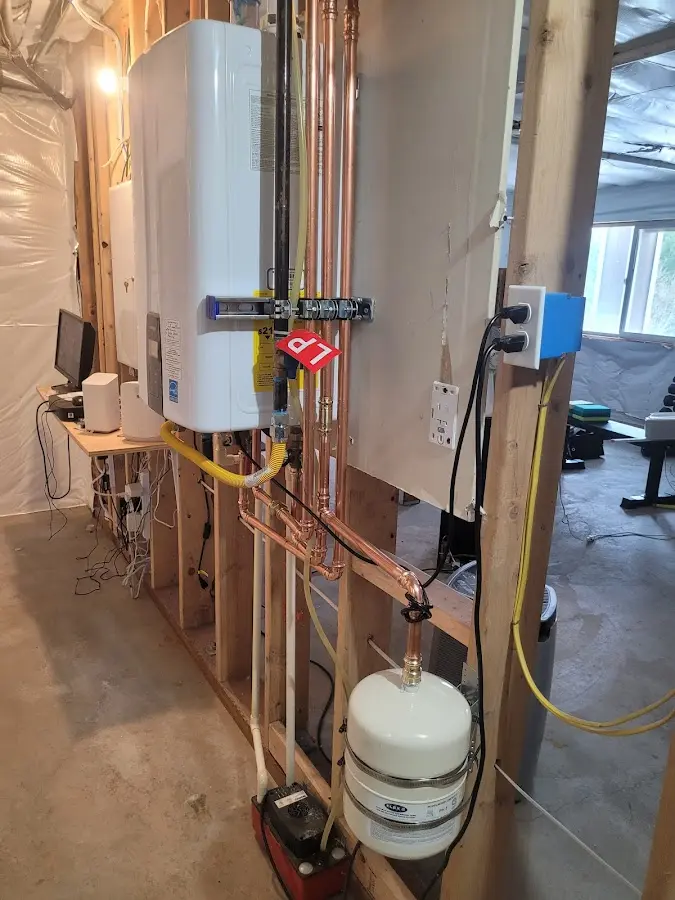 Licensed plumber repairing a kitchen sink in Ammon